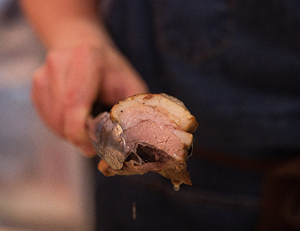 Chef Chris Cheung shows off his succulent pork belly at the East Wind Snack Shop.