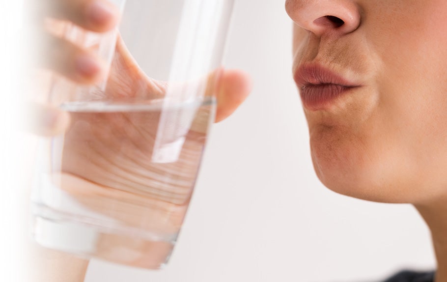 Woman Drinking Freshly Purified Softened Water