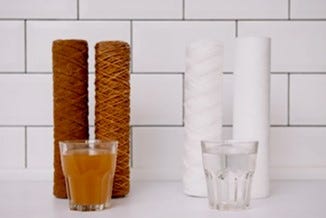 photo of dirty water filter and water on the left and clean water filters and water on the right