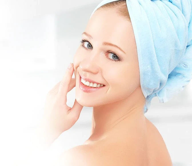 Lady Smiling with Towel Wrapped Around Her Head After a Nice Refreshing Shower in Soft Purified Water