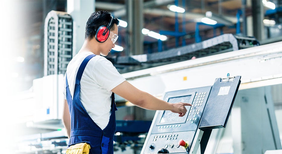 Man Working in a Factory Setting