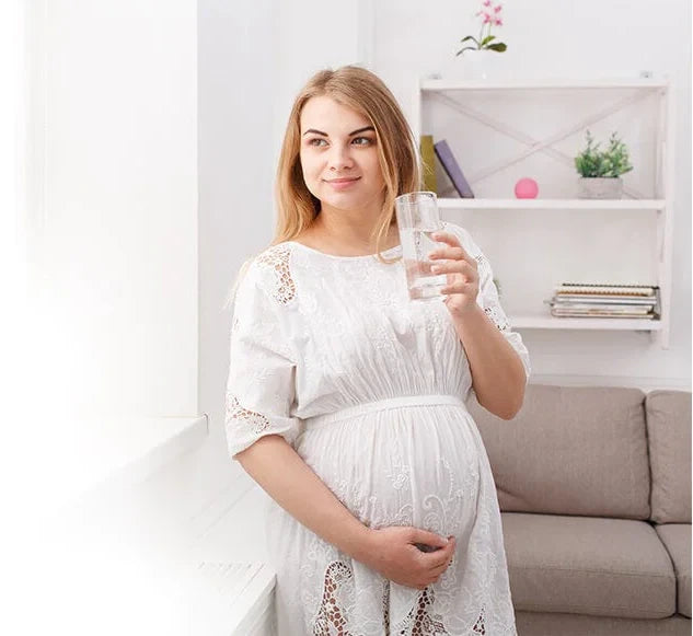 Pregnant Woman Drinking a Glass of Cold Water