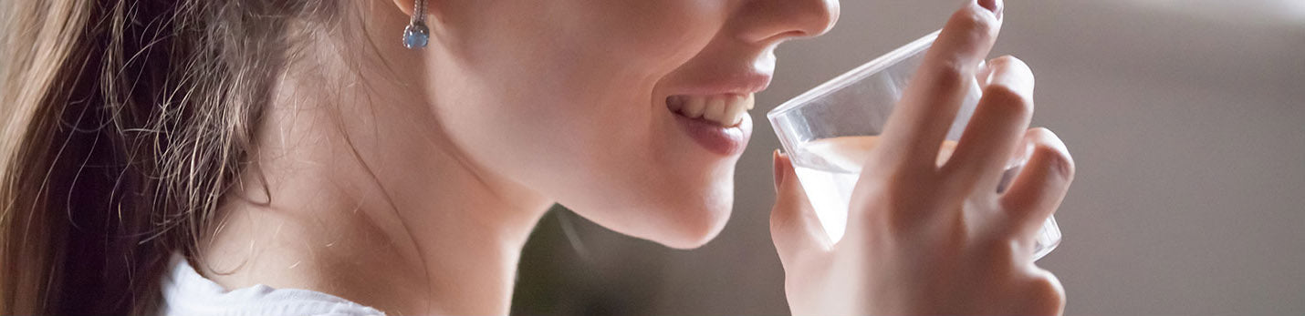 woman drinking safe water