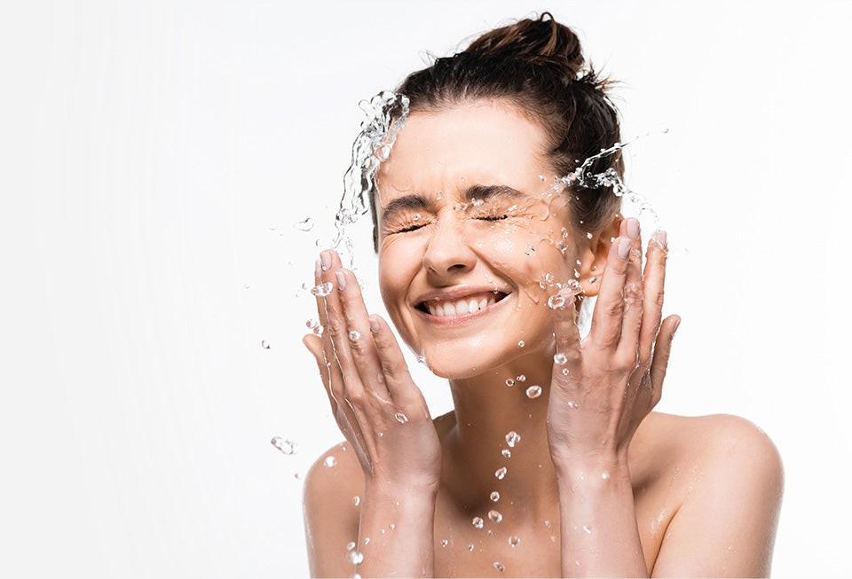 Woman Washing Face in Fresh Soft UV Disinfected Water Agua