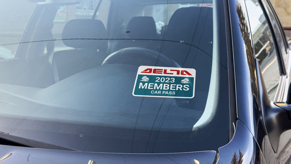 Custom printed front-adhesive die-cut sticker applied to the inside of a car windscreen