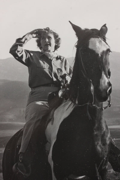 Mildred Titcomb riding a horse