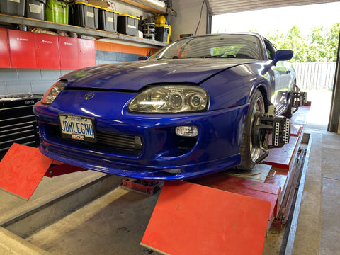 Blue MK4 Toyota Supra on a Hunter Alignment Rack