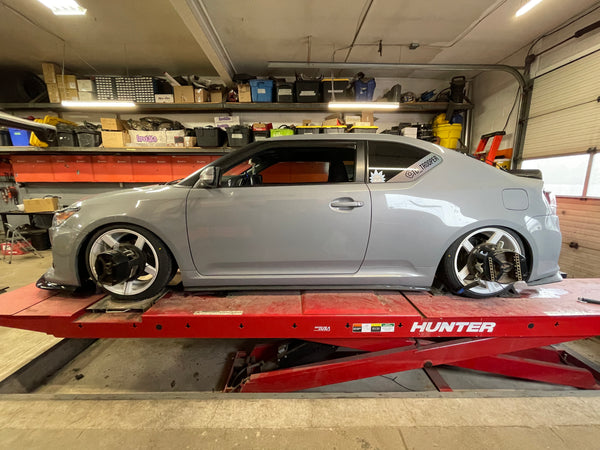 Very Low Ride Height Light Grey Scion tC on Our Hunter Alignment Rack