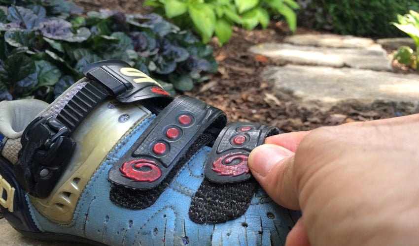 Adjusting one of the velcro straps on a conventional road cycling shoe