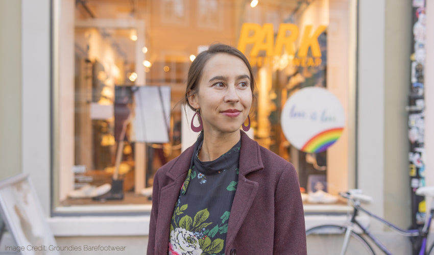 Image of Anya Jensen of Anya's Reviews standing in front of a shop in Germany