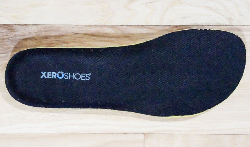 Top down view of a black Xero Shoes insole