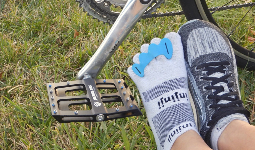 A combination of natural footgear, including Catalyst Pedals, Correct Toes, Injinji toe socks, and foot-shaped athletic shoes