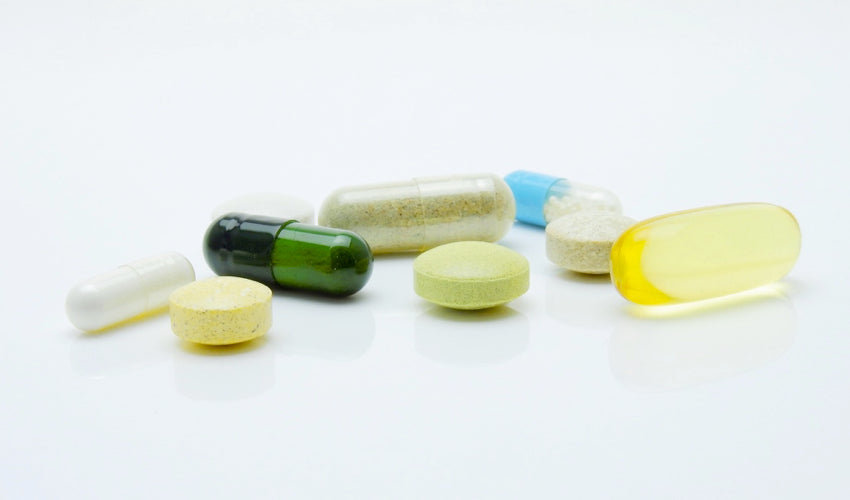 A variety of nutritional supplements against a white background