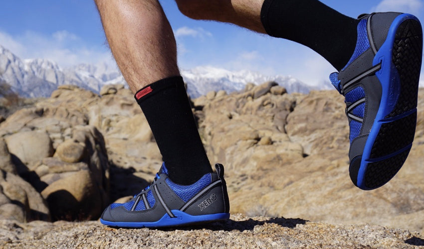 A trail runner wearing Xero Prio athletic shoes