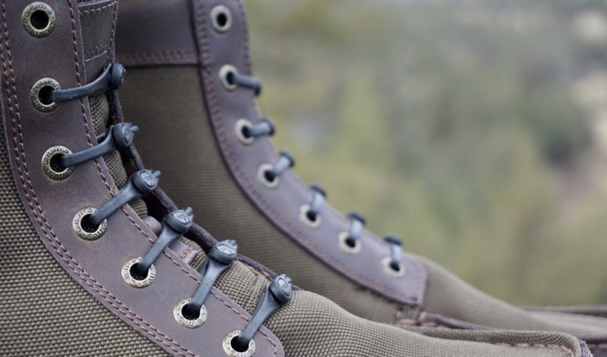 Close-up view of a set of no-tie laces used in conjunction with the Lems Boulder Boot in Timber