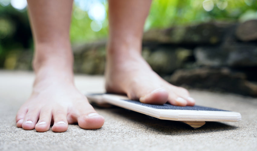 A foot resting flat on a BlackBoard Basic unit that incorporates PerformanceBars