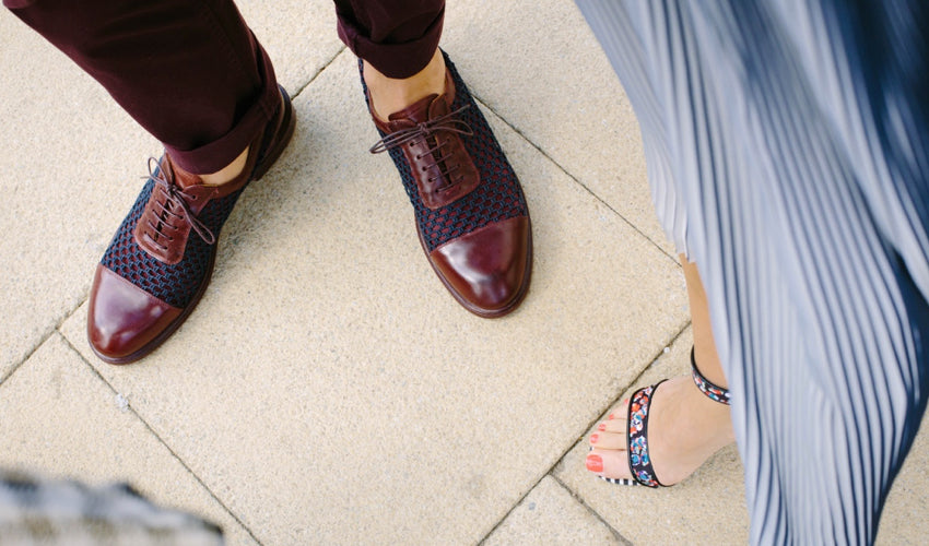 Top-down view of men's and women's dress footwear that incorporates tapering toe boxes