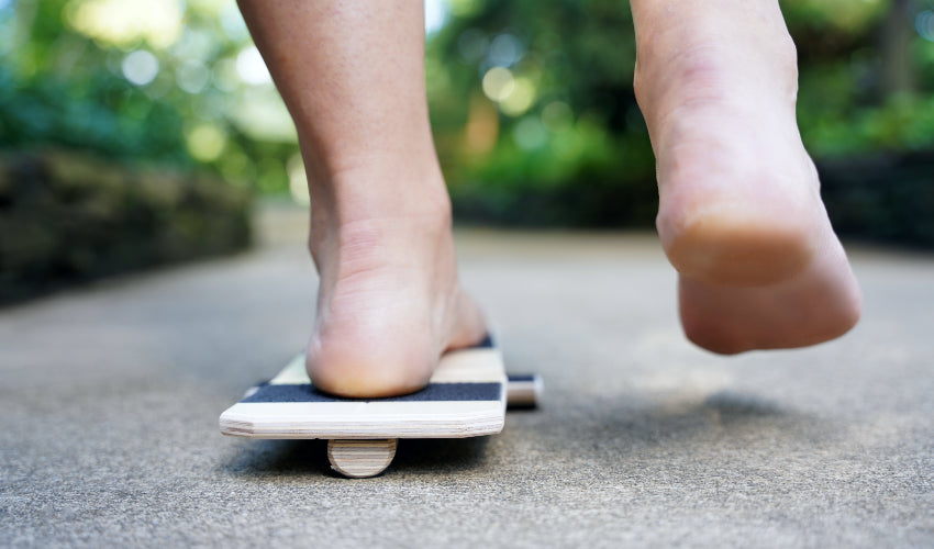 Left foot balancing on the BlackBoard Basic from behind