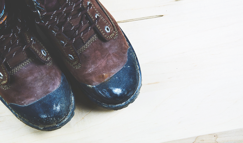 Top-down view of a pair of conventional hiking boots with rigid, inflexible soles