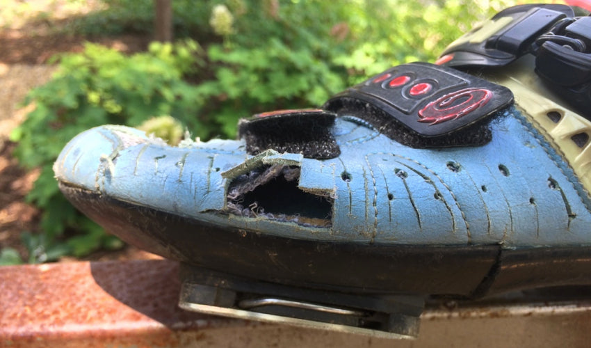 Open area where a portion of a cycling shoe's toe box sidewall has been removed
