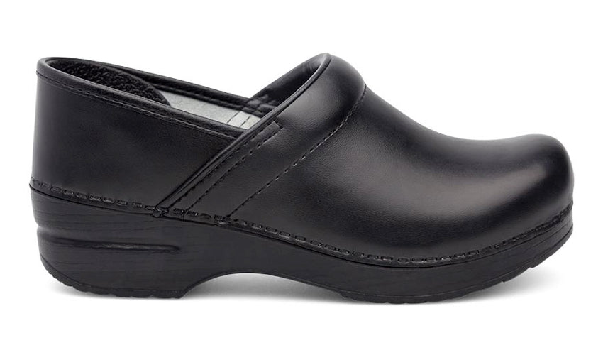 Close up image of a single black leather clog against a white background