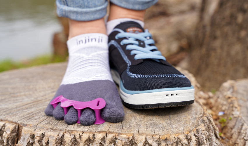 Person donning a pair of Correct Toes Original toe spacers