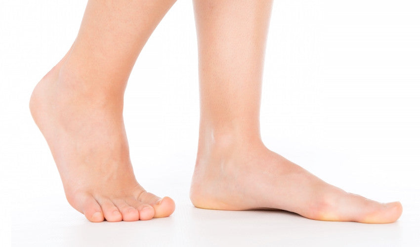 A pair of bare feet showing the medial longitudinal arch