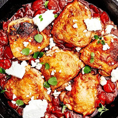 One-Pan Chicken Thighs With Burst Tomatoes, Harissa, and Feta