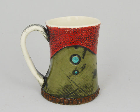 Handmade mug in red and dark green. 