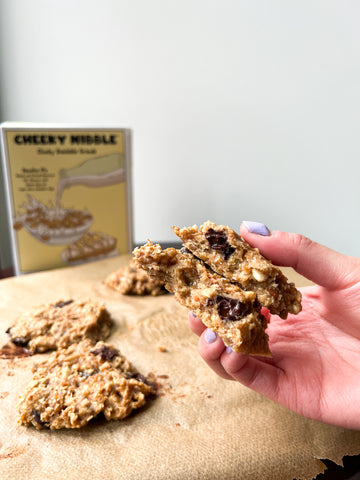 Soft and chewy banana granola cookie topped with dollops of creamy peanut butter and a generous sprinkling of rich chocolate chips