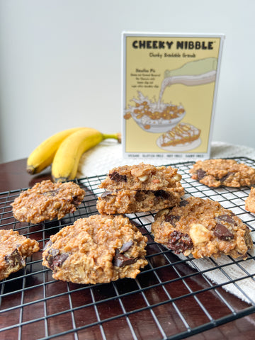 Soft and chewy banana-infused cookie topped with wholesome granola clusters, drizzled with rich peanut butter, and studded with indulgent chocolate chips.