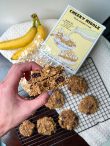 Soft and chewy banana-infused cookie topped with wholesome granola clusters, drizzled with rich peanut butter, and studded with indulgent chocolate chips.
