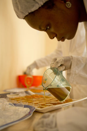 Artisan making shea butter with Ten Thousand Villages partner, Ele Agbe in Ghana. 