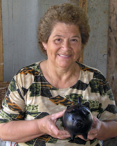 Lucia Valdez with piggy bank