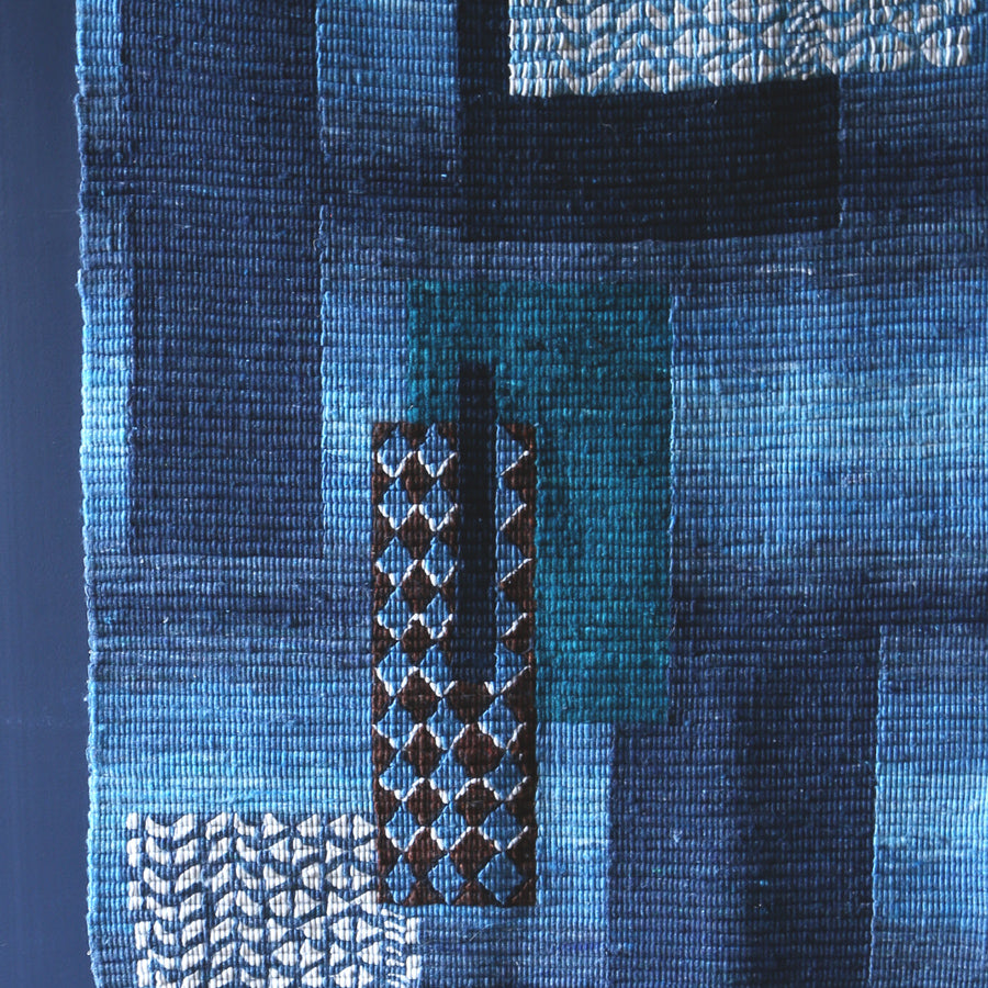 Craftsmanship. Herlinda Artola, textile craftsman, creates fair trade coiled wool wall hangings.