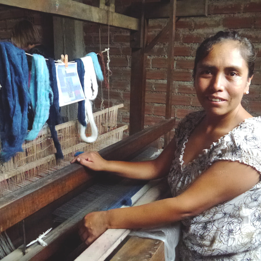 Craftsmanship. Herlinda Artola, textile craftsman, creates fair trade coiled wool wall hangings.