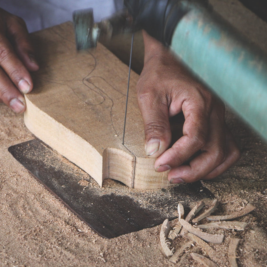 Craftsmanship. Wayan Diksa, wood craftsman, creates beautiful and practical woodwork from suar trees in Indonesia.