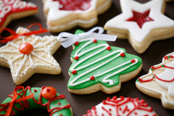 Festive Christmas cookies shaped like holiday symbols.