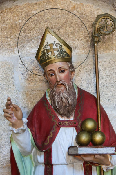 Statue of St. Nicholas with book and orb.