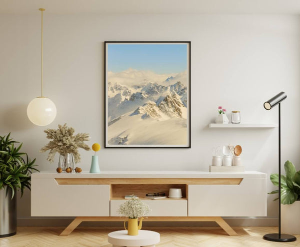 Modern room with a minimalist decor and a framed mountain landscape.