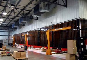 Welding bay or machine area with T4500x2 T-Series Ambient Air Cleaners installed as Industrial Air Cleaner Units