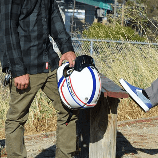 Torc T-3 Allegiance being held by motorcyclist on classic bike