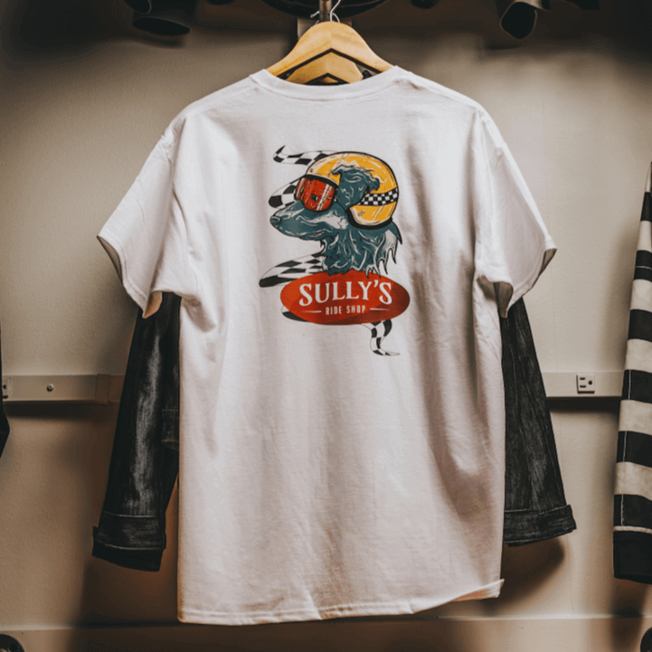 White Sully's tee hanging from retail display to show back design