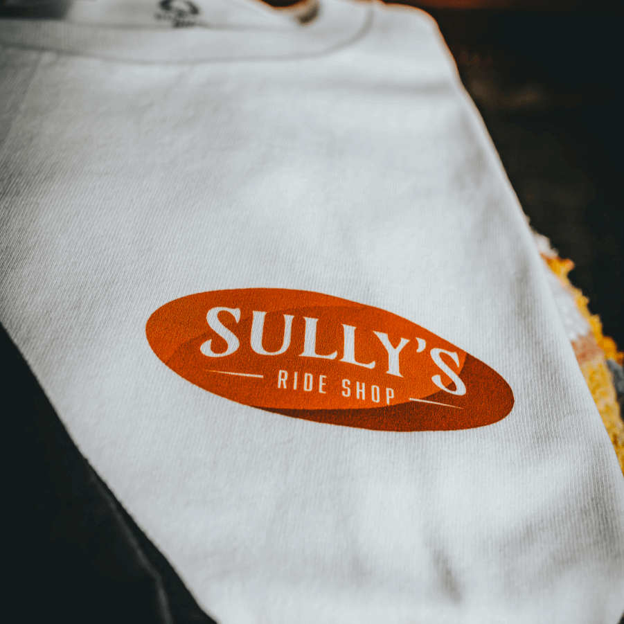 White Sully's tee chest logo close up