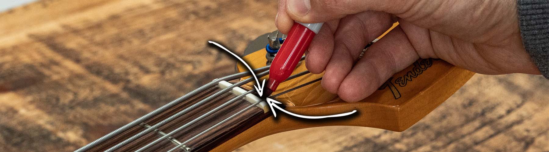 Before removing the string be sure to make a mark on the string with a permanent marker just behind the nut