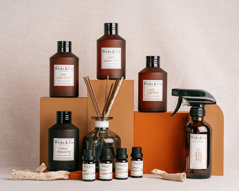 A Wicks & Co. collection of candles, diffusers, sprays, and essential oil