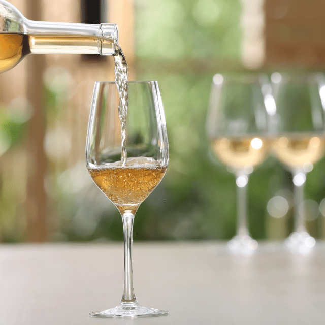 Pouring a glass of white wine