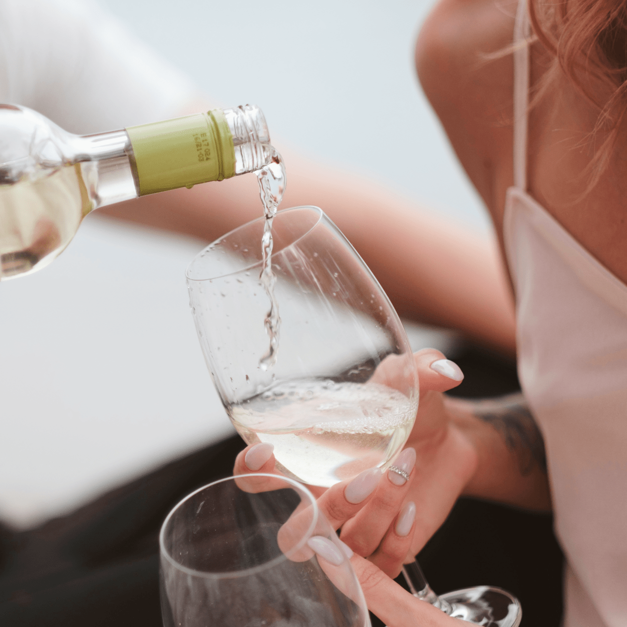 Pouring a glass of white wine | Macy's Wine Shop