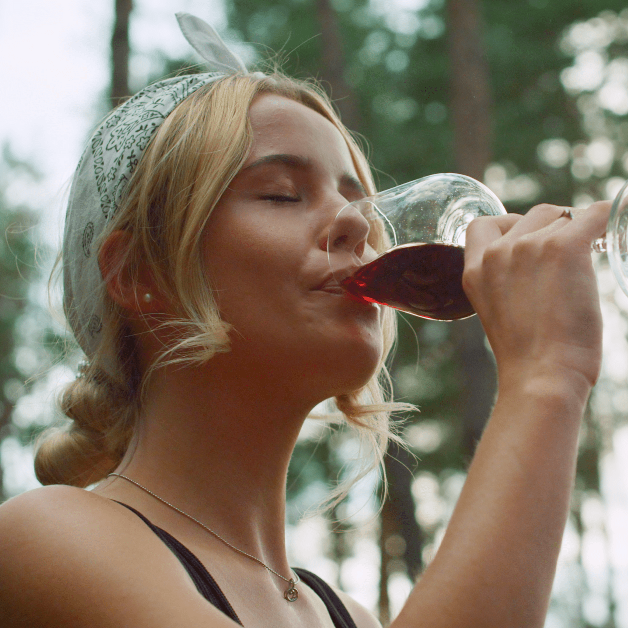 Woman drinking a glass of red wine | Macy's Wine Shop