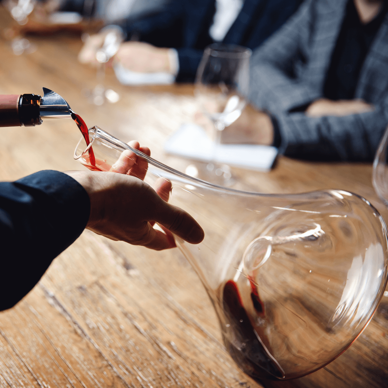 Pouring red wine into a decanter | Macy's Wine Shop